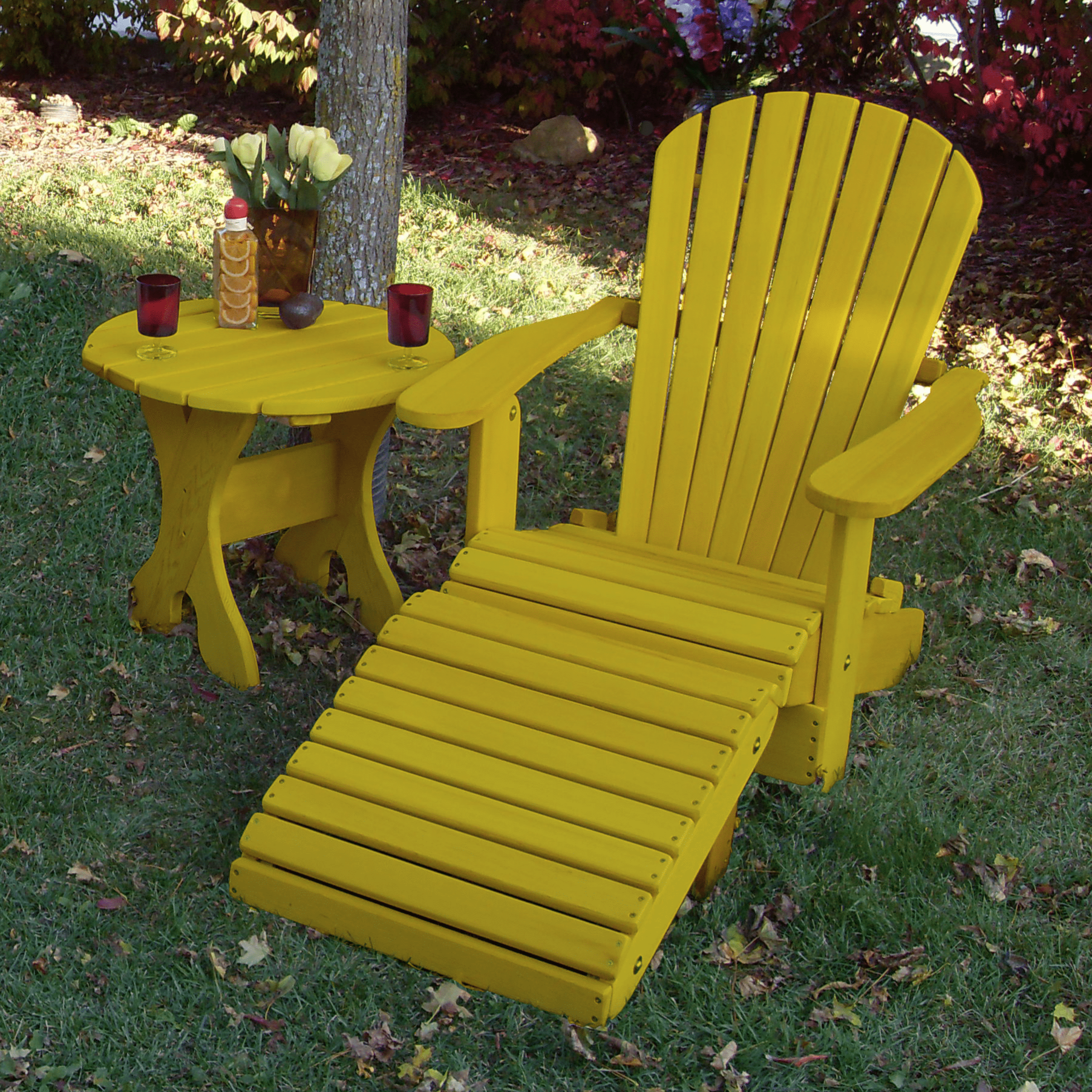 Lemon Yellow Poly-Luxe 100% Recycled Plastic Royal Single Patio Set, 1 Adirondack Royal Chair, 1 Royal Adirondack Footstool Ottoman and 1 Adirondack 24" Round Table www.thebestadirondackchair.com